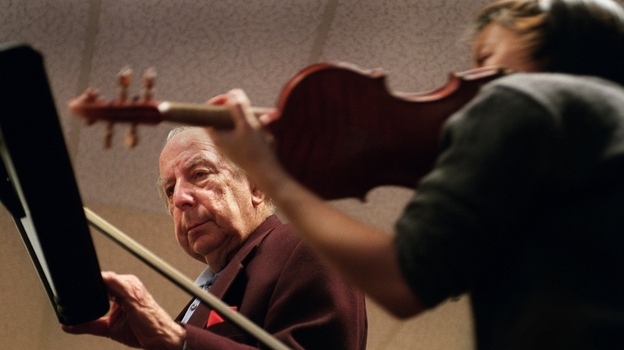 Totenberg teaches student Letitia Hom in his classroom at Boston University. Totenberg made his debut as a soloist with the Warsaw Philharmonic at age 11.