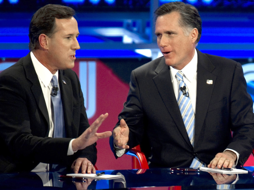 Back in their sparring days: Rick Santorum (left) and Mitt Romney during a Feb. 22, 2012, Republican presidential debate in Arizona.