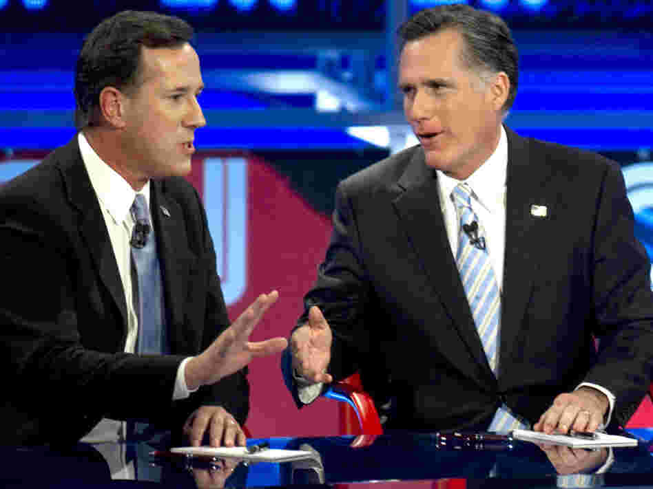 Back in their sparring days: Rick Santorum (left) and Mitt Romney during a Feb. 22, 2012, Republican presidential debate in Arizona.