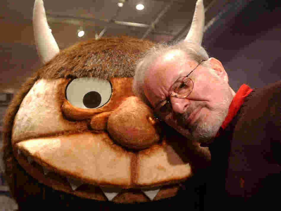 Maurice Sendak stands with a character from his book "Where the Wild Things Are," in 2002.
