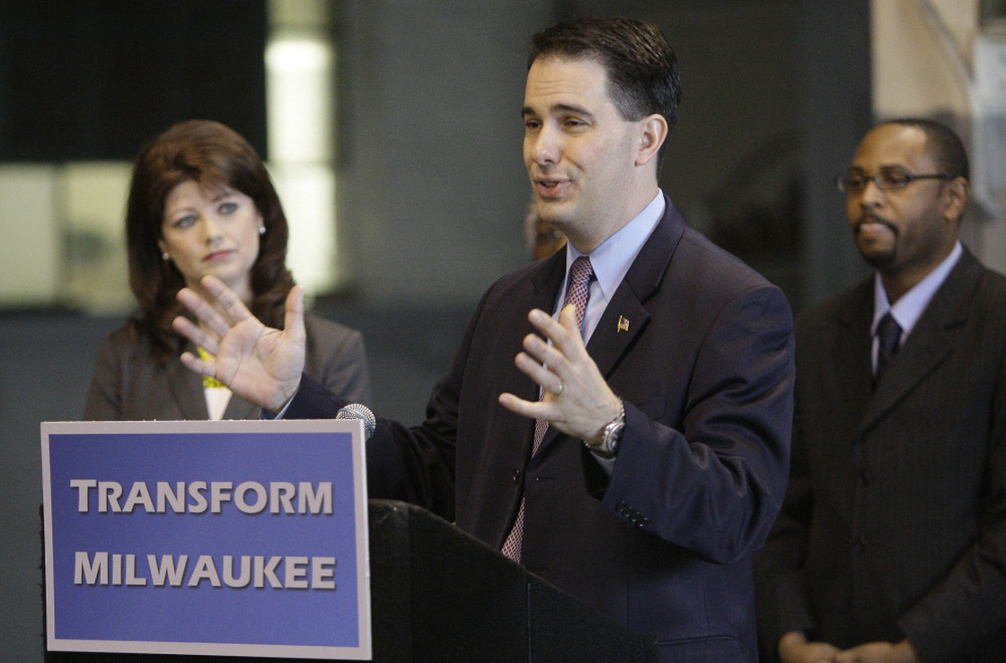 Gov. Scott Walker announces the $100 million "Transform Milwaukee" initiative at Hatco Corp. in Milwaukee on April 30, along with Lt. Gov. Rebecca Kleefisch and Workforce Development Director Reggie Newson. Walker faces a recall election June 5.
