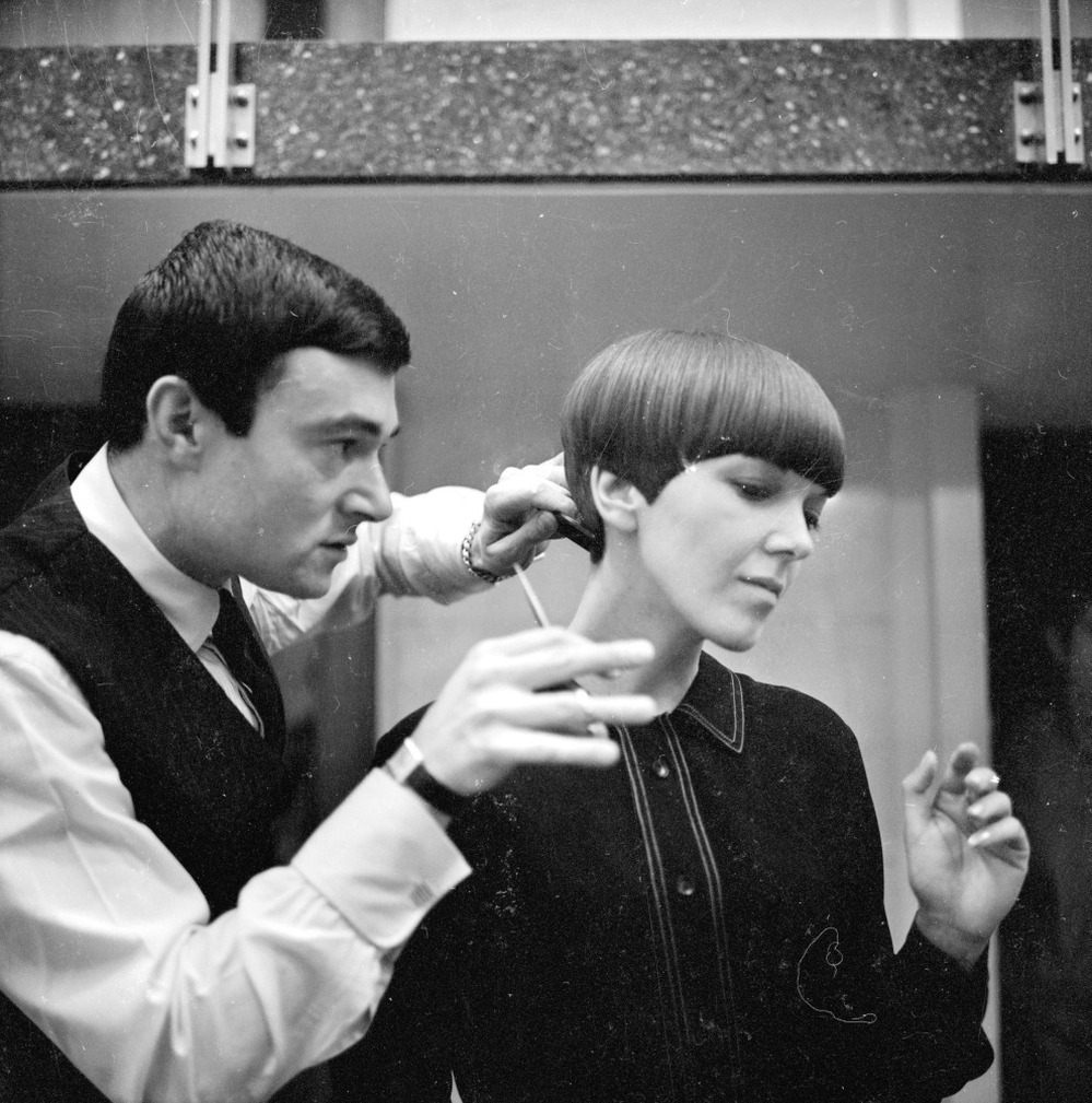 Clothes designer Mary Quant, one of the leading lights of the British fashion scene in the 1960's, having her hair cut by another fashion icon, hairdresser Vidal Sassoon in 1964.