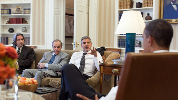 President Obama meets with actor George Clooney, U.S. Special Envoy for Sudan Princeton N. Lyman, and human rights activist John Prendergast (far left) at the White House on March 15.