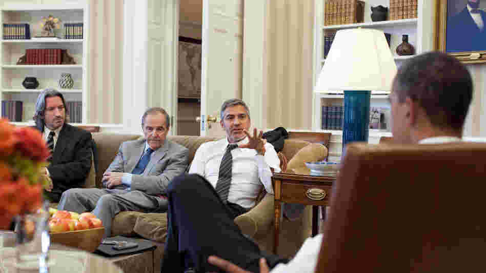 President Obama meets with actor George Clooney, U.S. Special Envoy for Sudan Princeton N. Lyman, and human rights activist John Prendergast (far left) at the White House on March 15.
