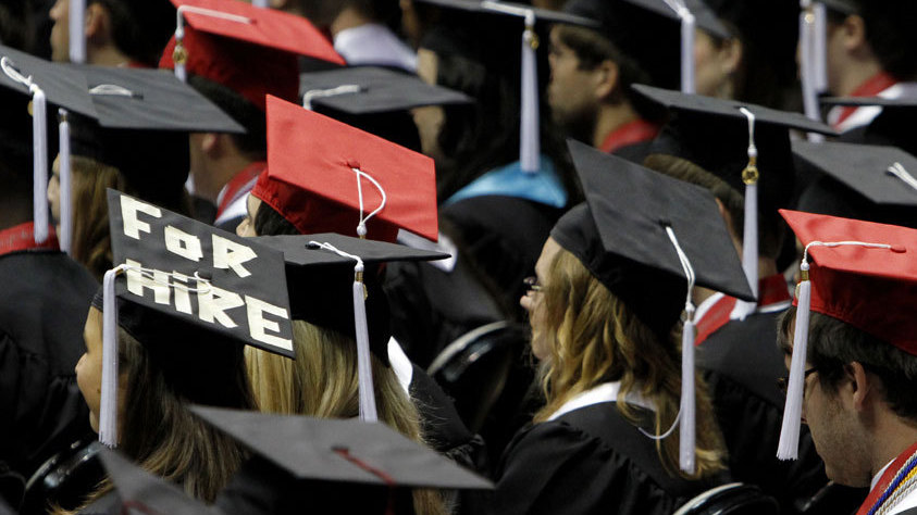 Graduates of the University of Alabama's class of 2011. The economic downturn has hit recent college grads hard. New data show only half of those who graduated from 2006 to 2011 are working full time.