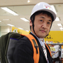 Store manager Naoto Higashi models a helmet, a fully stocked kit in his backpack, and a windup flashlight. Such items have become popular in Japan following last year's huge earthquake and tsunami.