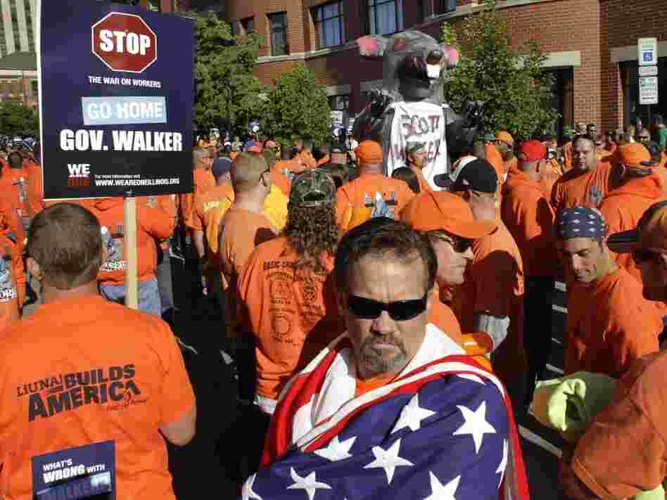 Protesters march outside the Abraham Lincoln Presidential Hotel where Wisconsin Gov. Scott Walker is speaking to the Illinois Chamber of Commerce on April 17 in Springfield, Ill. Walker faces Democrat Tom Barrett in a recall election June 5. The events in the state over the next four weeks could be a sign of where the U.S. is headed in the months ahea