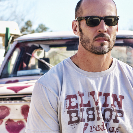 On a new covers album, the singer-songwriter champions what he calls "people of meager means."