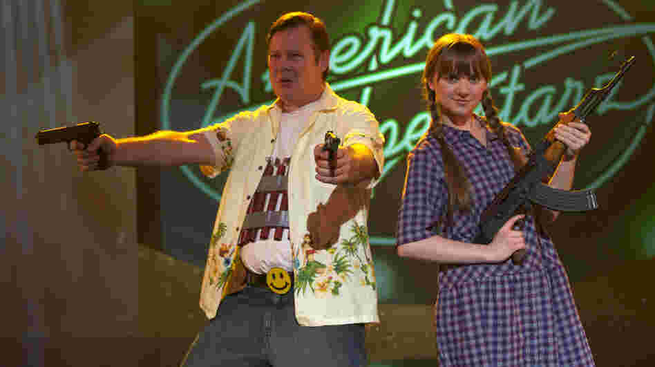 Turning depression and anger at his spiraling personal life outward, Frank (Joel Murray) — with sidekick Roxy (Tara Lynne Barr) — takes literal aim at the crasser forms of American pop culture. Turning depression and anger at his spiraling personal life outward, Frank (Joel Murray) — with sidekick Roxy (Tara Lynne Barr) — takes literal aim at the crasser forms of American pop culture.