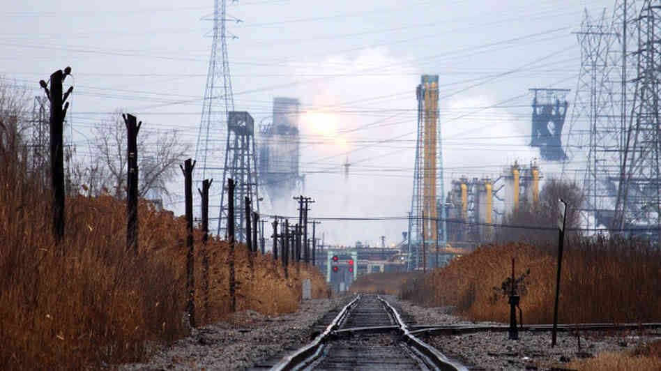 Huge belches of steam, smoke and flames rise from the smokestacks on Michigan's Zug Island. Residents of Windsor, Ontario, say they can hear a humming coming from the man-made island. Huge belches of steam, smoke and flames rise from the smokestacks on Michigan's Zug Island. Residents of Windsor, Ontario, say they can hear a humming coming from the man-made island.