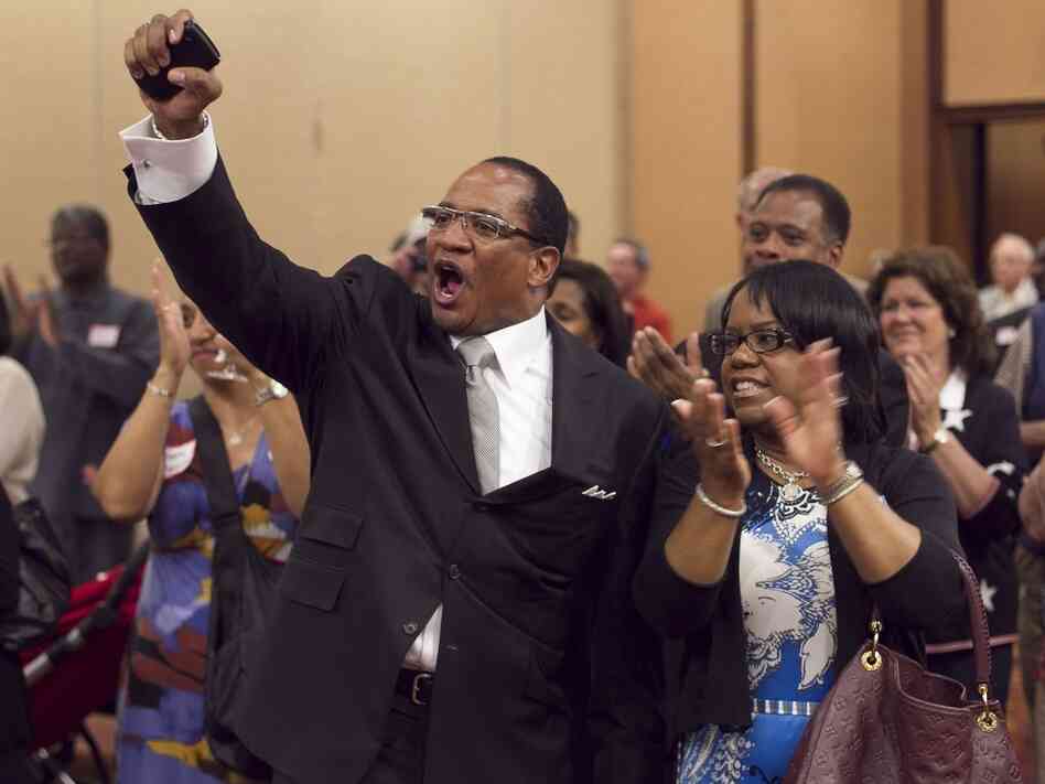 Dr. Patrick Wooden, senior pastor of the Upper Room Church of God In Christ and his wife, Pamela Wooden, celebrate early returns that show strong support for Amendment One during an election night party at the North Raleigh Hilton on Tuesday, May 8, 2012. The Amendment would ban gay marriage in the state. (Robert Willett/Raleigh News