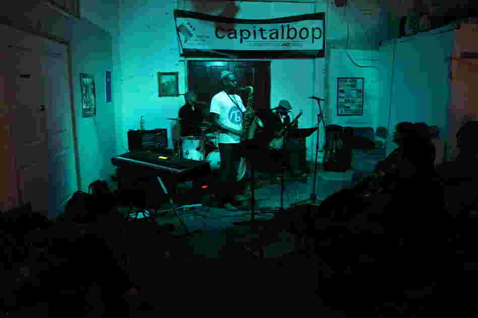 Mad Curious, with drummer Lenny Robinson, saxophonist Brian Settles and bassist Tarus Mateen, performs at a Capitalbop house show.