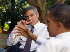 President Obama talks with actor George Clooney during a White House meeting about Sudan in 2010. The president is attending a fundraiser at Clooney's house Thursday, along with a few sweepstakes winners. President Obama talks with actor George Clooney during a White House meeting about Sudan in 2010. The president is attending a fundraiser at Clooney's house Thursday, along with a few sweepstakes winners.