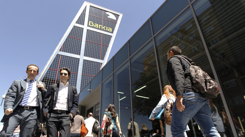 The Spanish government took a controlling stake in Bankia, the country's fourth-largest bank and largest real estate lender, on Wednesday.