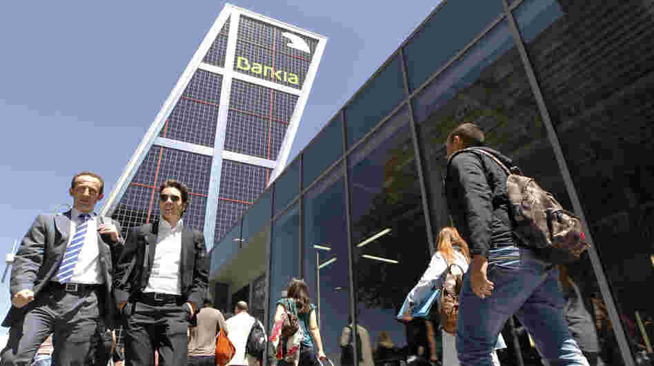 The Spanish government took a controlling stake in Bankia, the country's fourth-largest bank and largest real estate lender, on Wednesday.