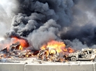 A pair of powerful bombs killed more than 50 people on the outskirts of Damascus on Thursday. This photo released by the official Syrian news agency SANA shows the aftermath. The blasts were the latest blow to a collapsing peace plan. A pair of powerful bombs killed more than 50 people on the outskirts of Damascus on Thursday. This photo released by the official Syrian news agency SANA shows the aftermath. The blasts were the latest blow to a collapsing peace plan.