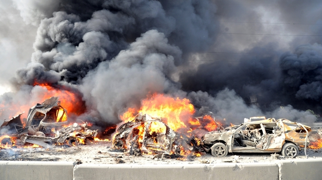 A pair of powerful bombs killed more than 50 people on the outskirts of Damascus on Thursday. This photo released by the official Syrian news agency SANA shows the aftermath. The blasts were the latest blow to a collapsing peace plan.