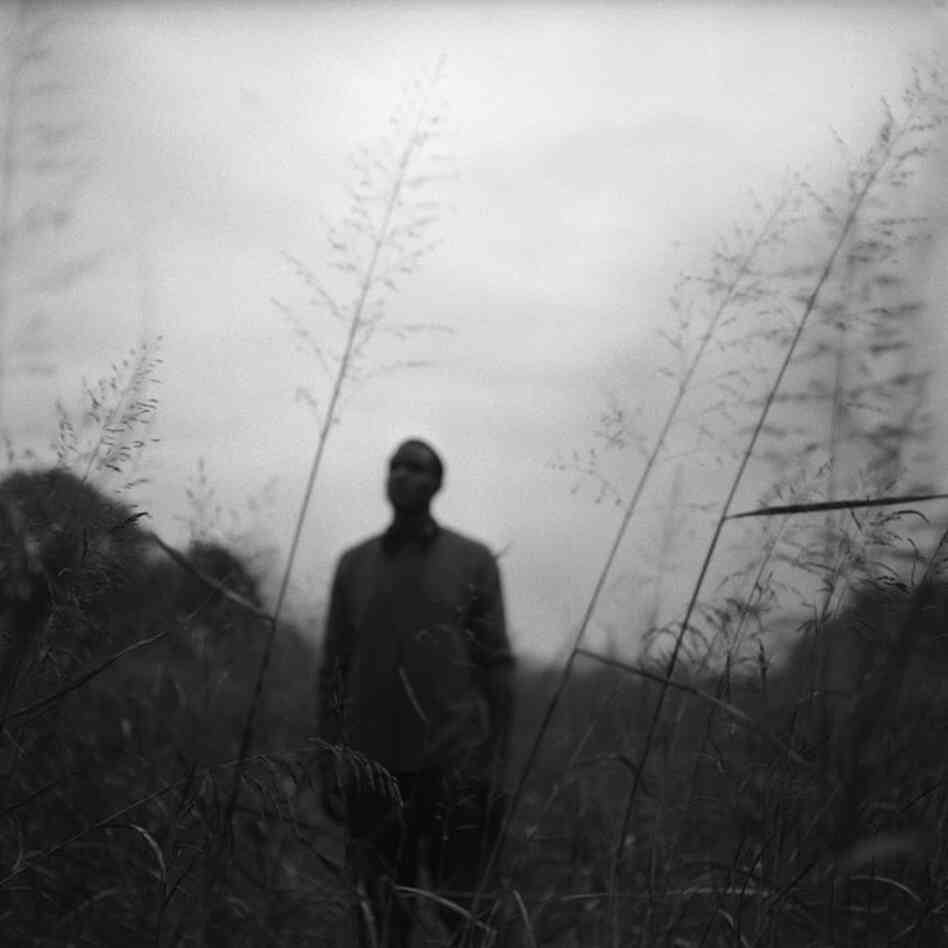 A young man stands alone in a field near his home in Mound Bayou, November 2011.