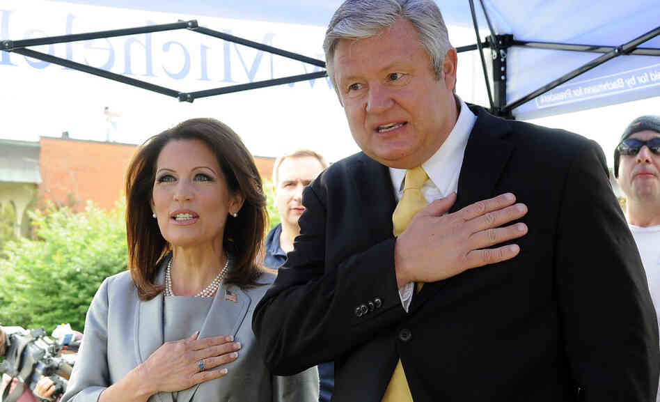 Minnesota Republican Rep. Michele Bachmann and her husband, Marcus, recite the Pledge of Allegiance before announcing her candidacy for president last June in Waterloo, Iowa.