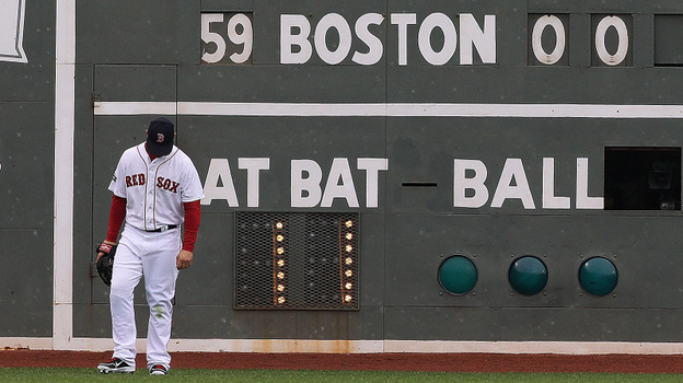 Boston Red Sox left fielder Cody Ross looks down during a seven-run third inning against the Baltimore Orioles at Fenway Park on May 5. The Red Sox trail their division, losing 11 of their last 12 home games. Boston Red Sox left fielder Cody Ross looks down during a seven-run third inning against the Baltimore Orioles at Fenway Park on May 5. The Red Sox trail their division, losing 11 of their last 12 home games.