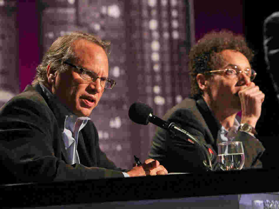 Buzz Bissinger (left) and Malcolm Gladwell argue for banning college football in an Intelligence Squared U.S. debate.