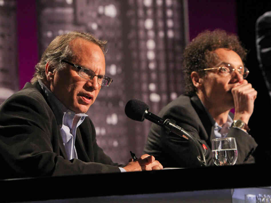 Buzz Bissinger (left) and Malcolm Gladwell argue for banning college football in an Intelligence Squared U.S. debate.