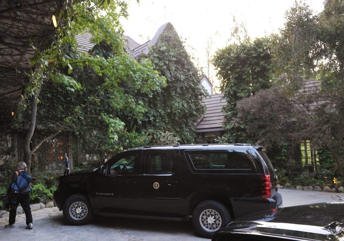 A presidential SUV is seen outside of the house of actor George Clooney on Thursday in Los Angeles.