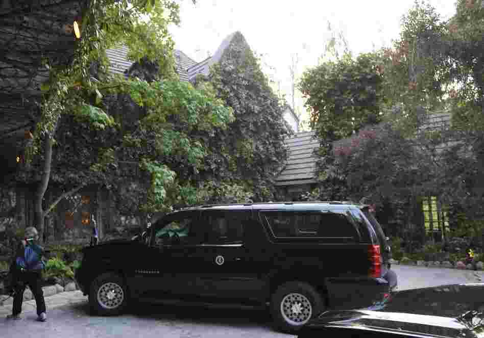 A presidential SUV is seen outside of the house of actor George Clooney on Thursday in Los Angeles.