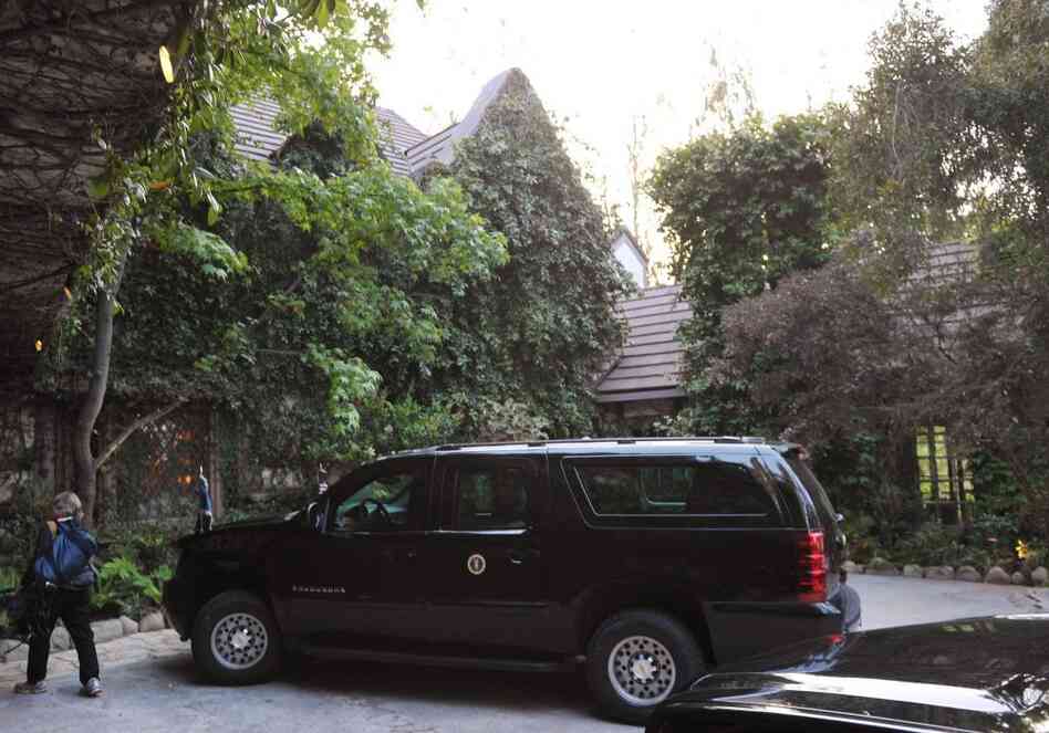 A presidential SUV is seen outside of the house of actor George Clooney on Thursday in Los Angeles.