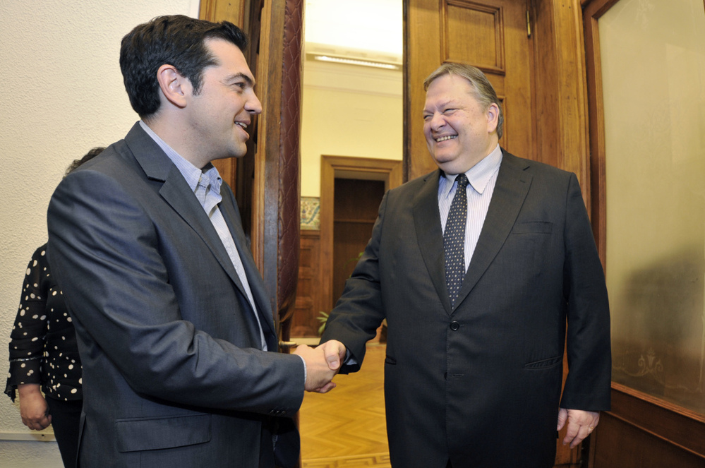 Greece's radical leftist party Syriza chief Alexis Tsipras (L) shakes hands with Socialists leader Evangelos Venizelos before their meeting at the Greek parliament in Athens on Friday. Venizelos admitted that he had failed in a last-ditch bid to form a government after Syriza key leftist party ruled out joining a pro-austerity coalition.