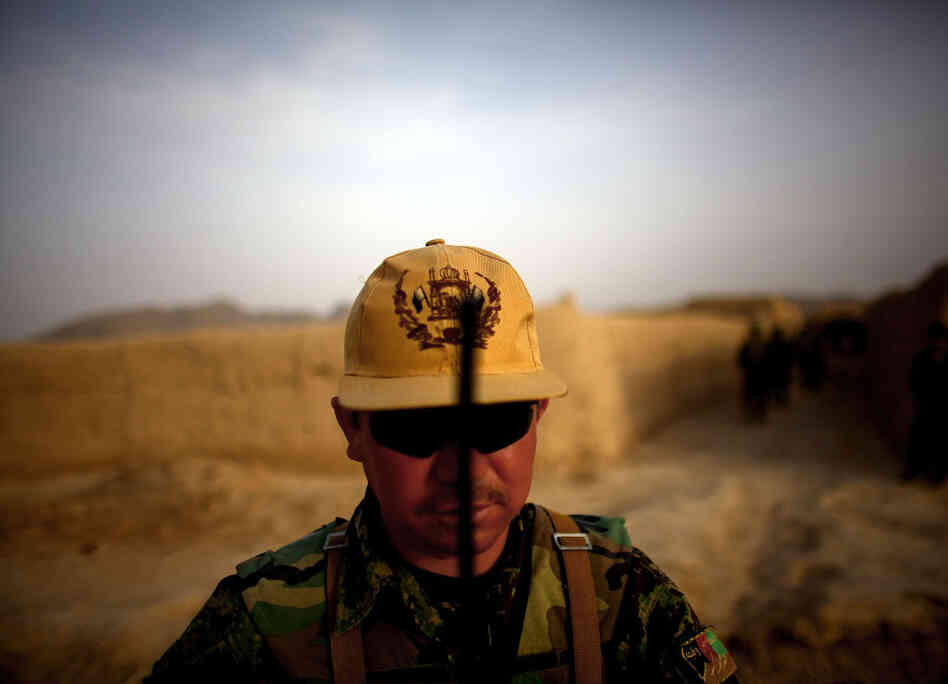 Afghan National Army platoon Sgt. Hyatulla Hakimi watches over his men while on a joint patrol. Afghan National Army platoon Sgt. Hyatulla Hakimi watches over his men while on a joint patrol.