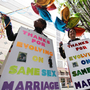 Marriage equality supporters Teri McClain (left) and Mary Beth Brotski demonstrate Thursday in Seattle.