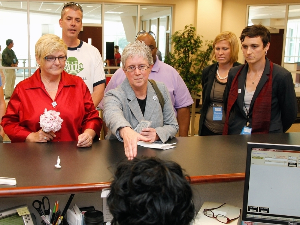 In protest of state law, a same-sex couple attempts to obtain a marriage license at the Forsyth County Register of Deeds office in Winston-Salem, N.C., Thursday, May 10.