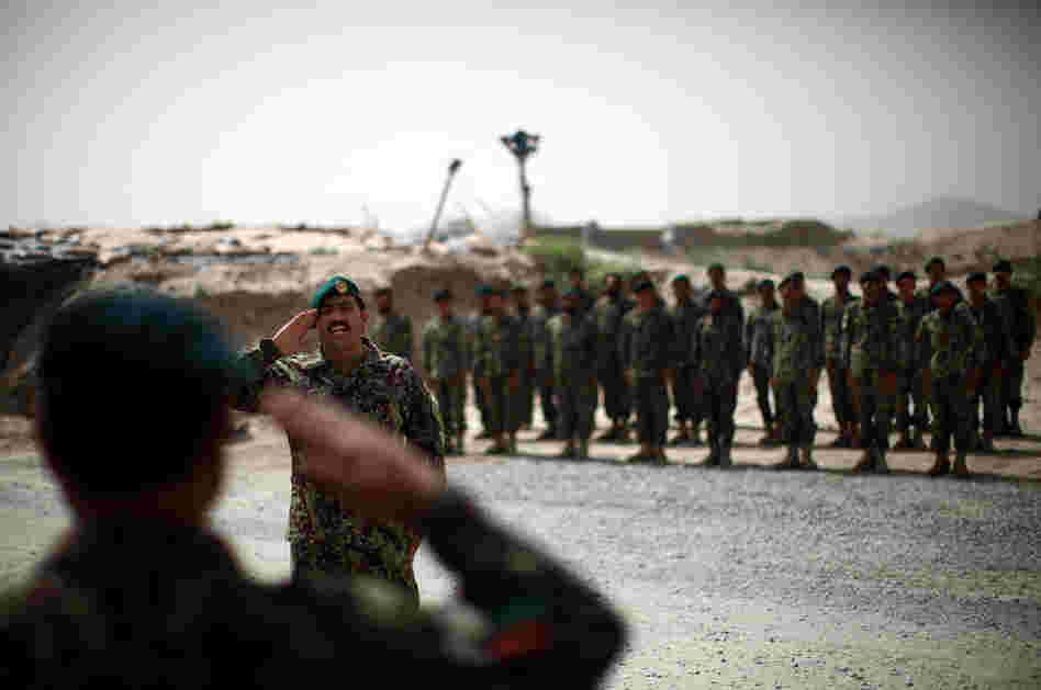 Brig. Gen. Ahmed Habbibi of the Afghan National Army salutes his soldiers in Panjwai district near Kandahar in southern Afghanistan. Brig. Gen. Ahmed Habbibi of the Afghan National Army salutes his soldiers in Panjwai district near Kandahar in southern Afghanistan.