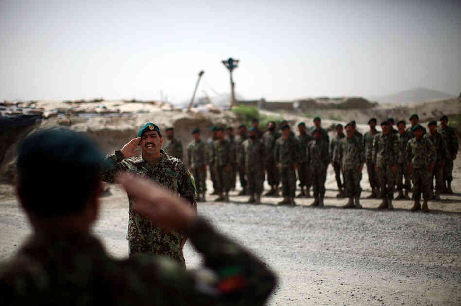Brig. Gen. Ahmed Habbibi of the Afghan National Army salutes his soldiers in Panjwai district near Kandahar in southern Afghanistan. Brig. Gen. Ahmed Habbibi of the Afghan National Army salutes his soldiers in Panjwai district near Kandahar in southern Afghanistan.
