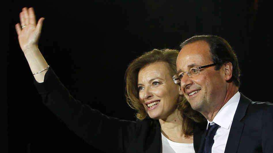 French President-elect Francois Hollande waves to supporters with his companion, Valerie Trierweiler, as he celebrates his election victory in Bastille Square in Paris, May 6. Hollande and Trierweiler will be the first unmarried couple to move into the French presidential palace. French President-elect Francois Hollande waves to supporters with his companion, Valerie Trierweiler, as he celebrates his election victory in Bastille Square in Paris, May 6. Hollande and Trierweiler will be the first unmarried couple to move into the French presidential palace.