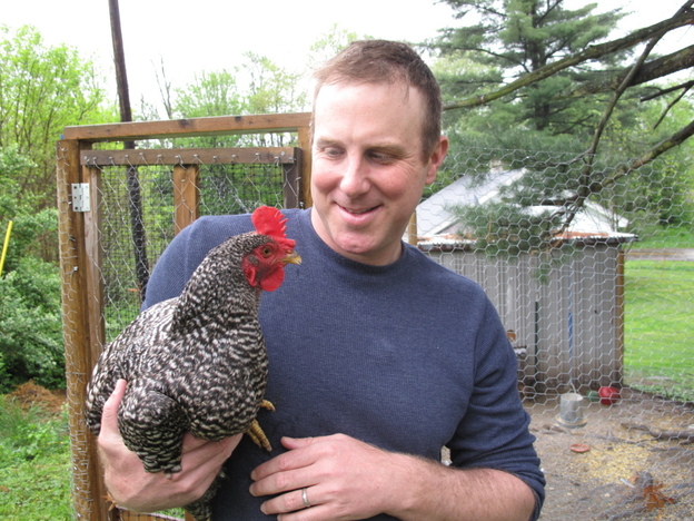 Ethan Brown, founder of Beyond Meat, holds a chicken  raised on his family's farm. He says childhood experience with farm animals was the inspiration for starting his company.