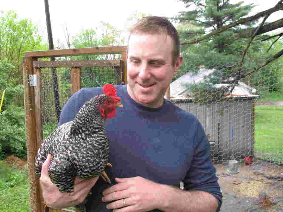 Ethan Brown, founder of Beyond Meat, holds a chicken  raised on his family's farm. He says childhood experience with farm animals was the inspiration for starting his company.