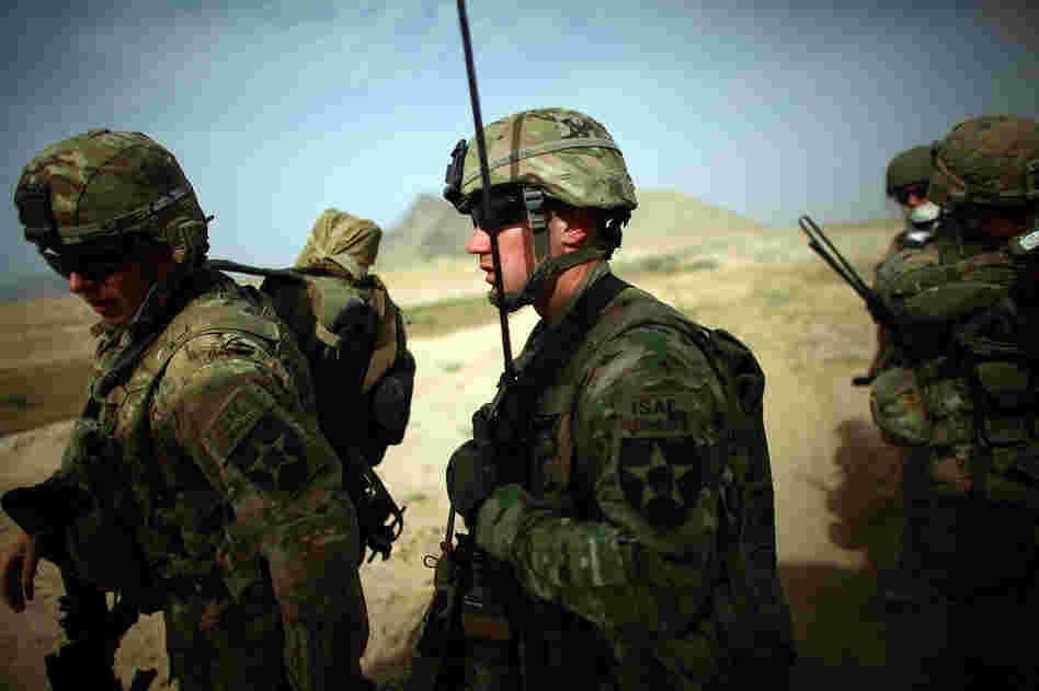 Capt. Chris Longto, of Joint Base Lewis-McChord Stryker brigade, heads out on patrol with Afghan soldiers in a rural area of Kandahar province, where the Taliban is still a threat.