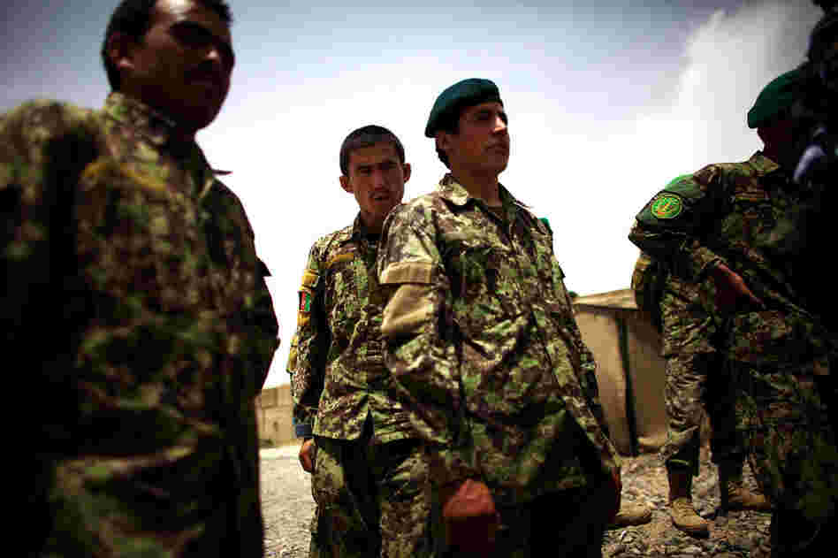 Afghan soldiers prepare for a joint patrol with U.S. Army troops. The Americans are pushing the Afghans to take more responsibility for their own security before the U.S. combat role ends in 2014.