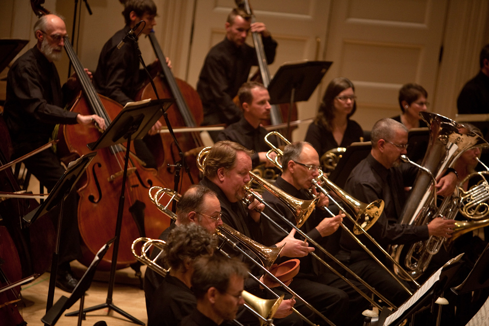 It took another composer, Larry Austin, three decades to complete a version of Ives' unfinished symphony, which calls for a gigantic brass section.