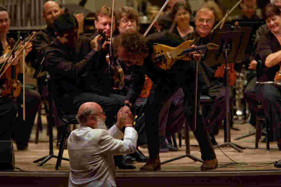 Terry Riley (center), one of the founders of minimalism, now often writes music lush with melody, drawing on a variety of American and world music influences. 