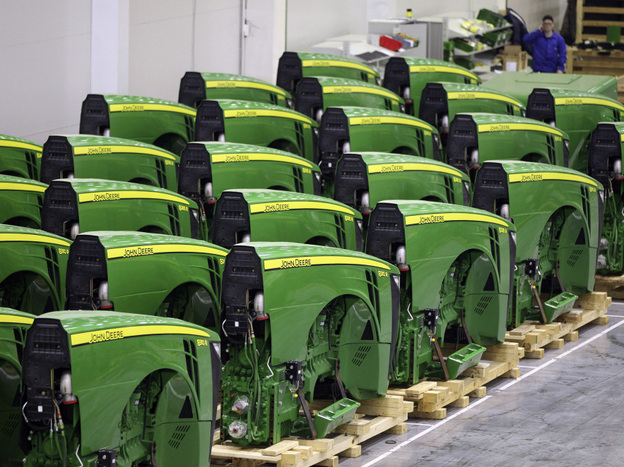 Completed front sections of John Deere tractors await further assembly inside the company's plant near Moscow.