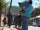 Honduran soldiers patrol poor neighborhoods in the outskirts of Tegucigalpa due to a deterioration of the police force.