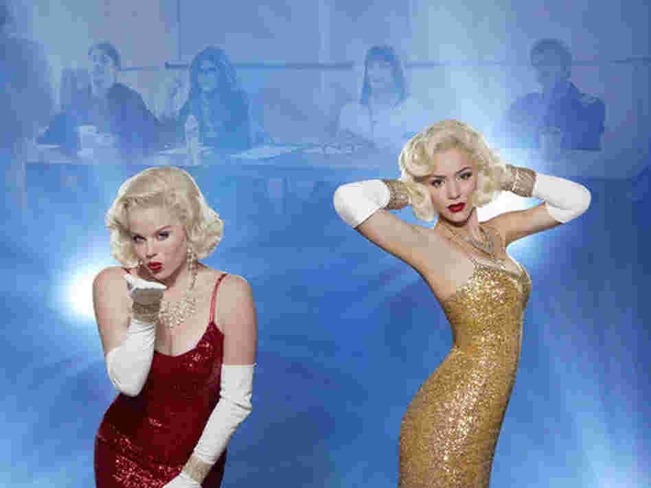 In foggy focus: Christian Borle as Tom Levitt, Debra Messing as Julia Houston, Anjelica Huston as Eileen Rand, Jack Davenport as Derek Wills. In actual focus: Megan Hilty as Ivy Lynn and Katharine McPhee as Karen Cartwright on NBC's Smash. In foggy focus: Christian Borle as Tom Levitt, Debra Messing as Julia Houston, Anjelica Huston as Eileen Rand, Jack Davenport as Derek Wills. In actual focus: Megan Hilty as Ivy Lynn and Katharine McPhee as Karen Cartwright on NBC's Smash.