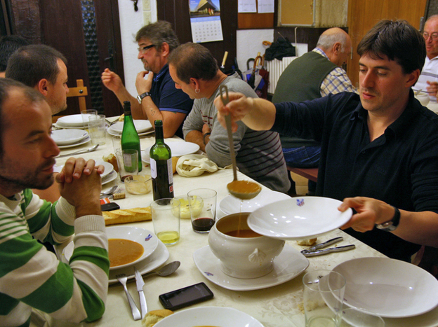 Enrique Vallejo serves soup at the Amaikak Bat txoko in San Sebastian.
