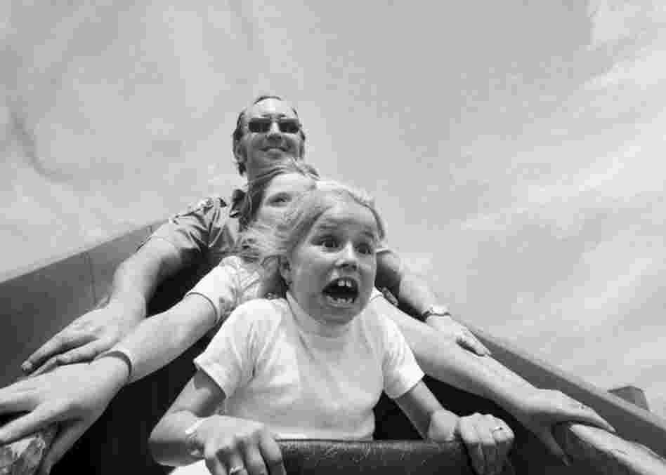 Aug. 2, 1976: Doreen Haviland (front) rides a roller coaster at Coney Island at the 40th annual Police Anchor Club outing for the widows and children of deceased police officers.