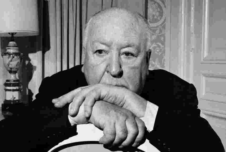 April 1, 1976: Alfred Hitchcock in his suite at the St. Regis Hotel in New York. A note on the back of the photograph clarified who was directing the photo shoot: "The picture showing Mr. Hitchcock creeping his way through the plant in his room was his idea." 