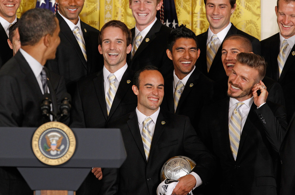President Obama gets a laugh after mentioning soccer superstar David Beckham's (right) line of underwear while congratulationg the Major League Soccer champions Los Angeles Galaxy in the East Room of the White House.