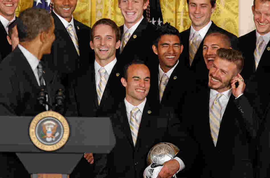 President Obama gets a laugh after mentioning soccer superstar David Beckham's (right) line of underwear while congratulationg the Major League Soccer champions Los Angeles Galaxy in the East Room of the White House.